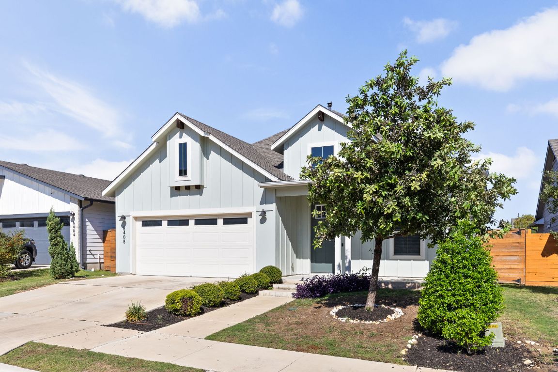 8408 Orizzonte Street Austin, TX 78744 - Photo 2 of 31 a front view of a house with garden