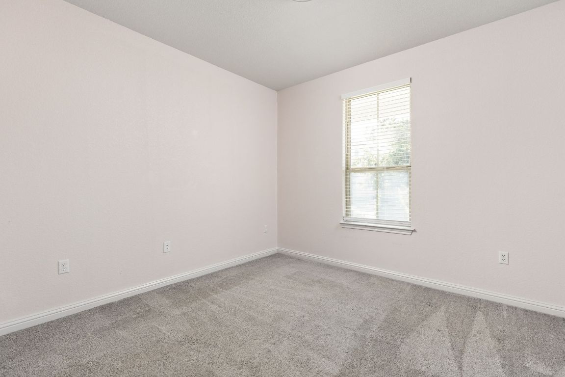 8408 Orizzonte Street Austin, TX 78744 - Photo 24 of 31 an empty room with a window