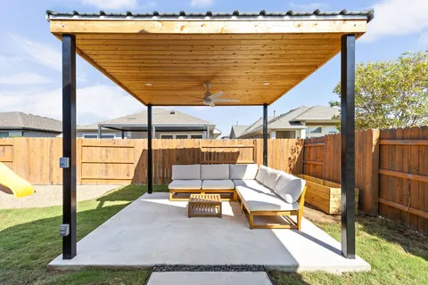 a view of swimming pool with a lounge chairs