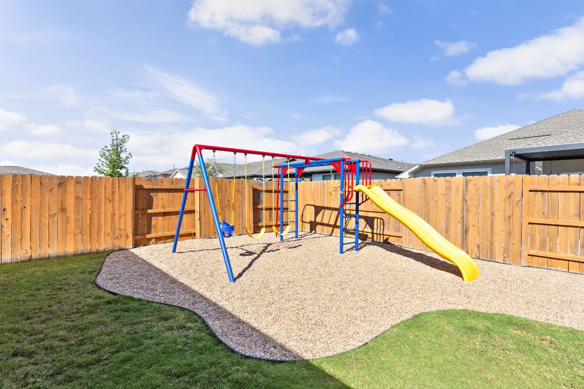 8408 Orizzonte Street Austin, TX 78744 - Photo 29 of 31 a view of a slide