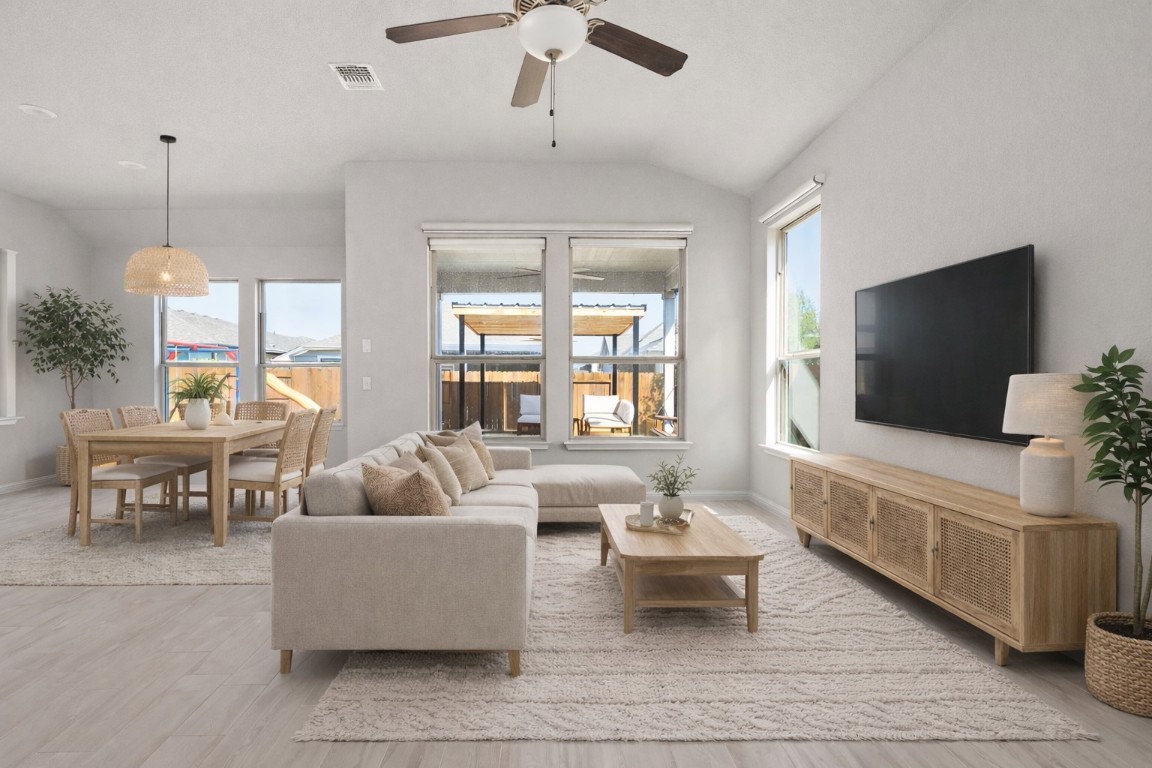 8408 Orizzonte Street Austin, TX 78744 - Photo 10 of 31 a living room with furniture and a flat screen tv