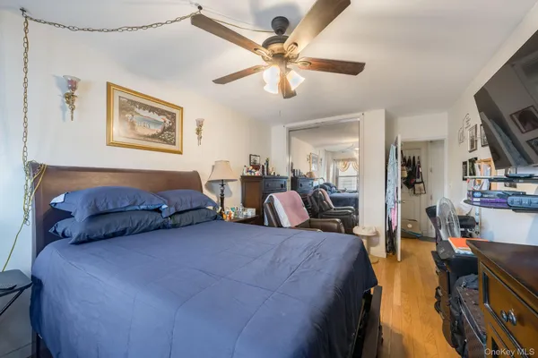 a spacious bedroom with two beds and a chandelier