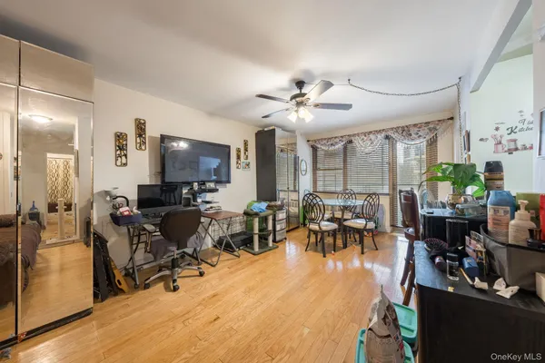 a living room with lots of furniture and a large window