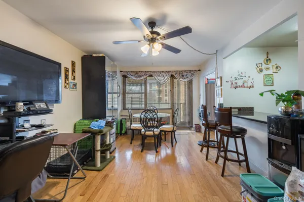 a view of a dining room with furniture window and wooden floor