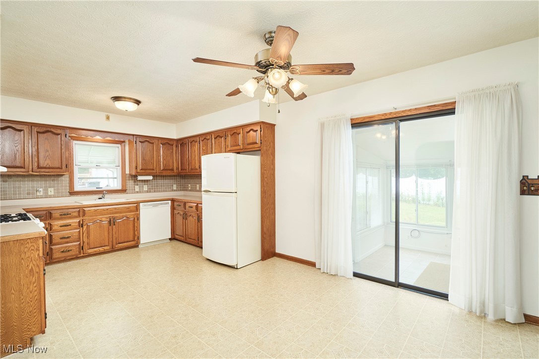 415 West Waterloo Road Akron, OH 44314 - Photo 11 of 24 KITCHEN W/SLIDER TO ENCLOSED PATIO