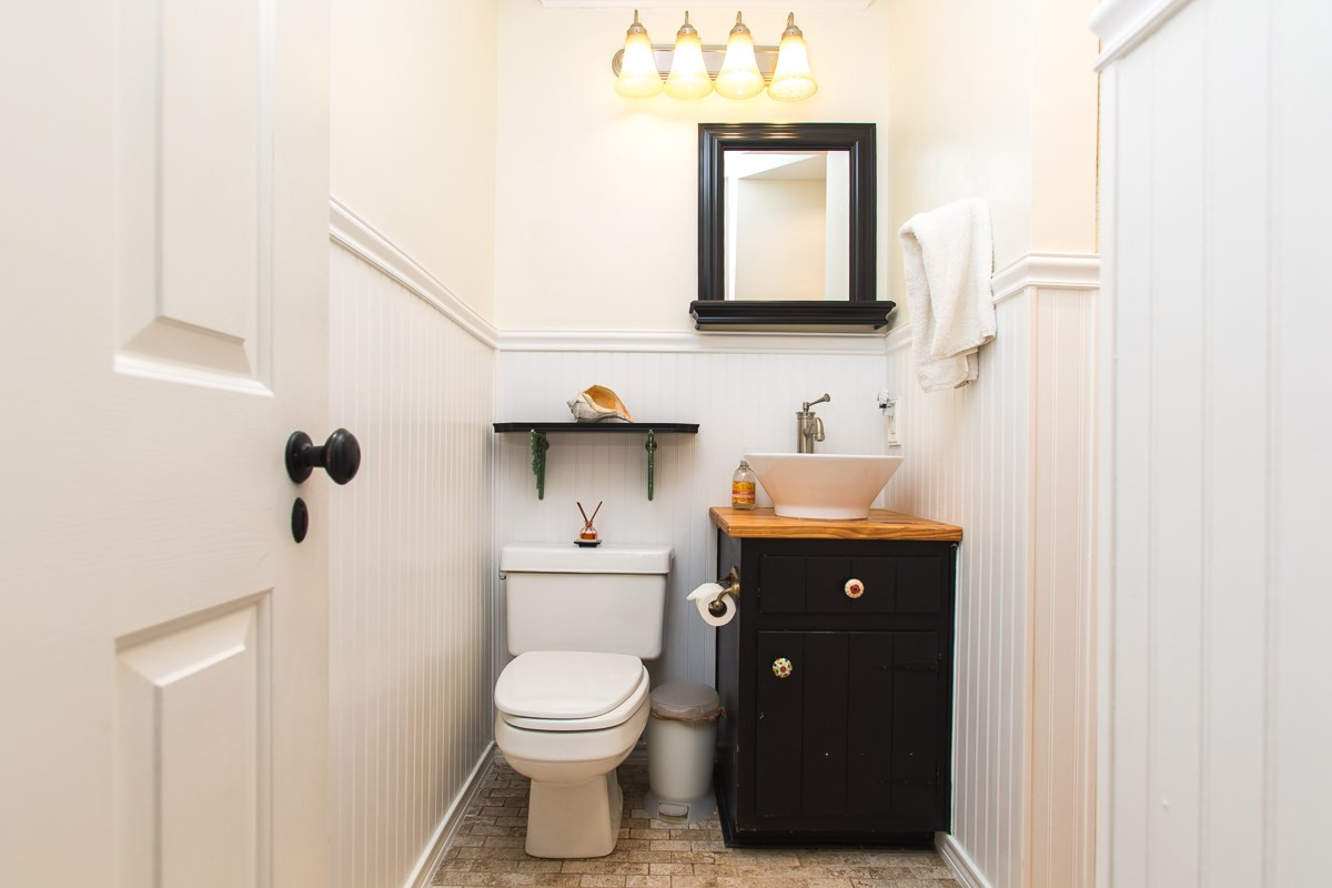 1715 Six Gables Road Durham, NC 27712 - Photo 20 of 25 The Jack-n-Jill bathroom has been updated for a more modern and fun appearance and function. There is a tub/shower area just to the right of this sink and another door that leads to the other bedroom. Great shared space! Bathroom