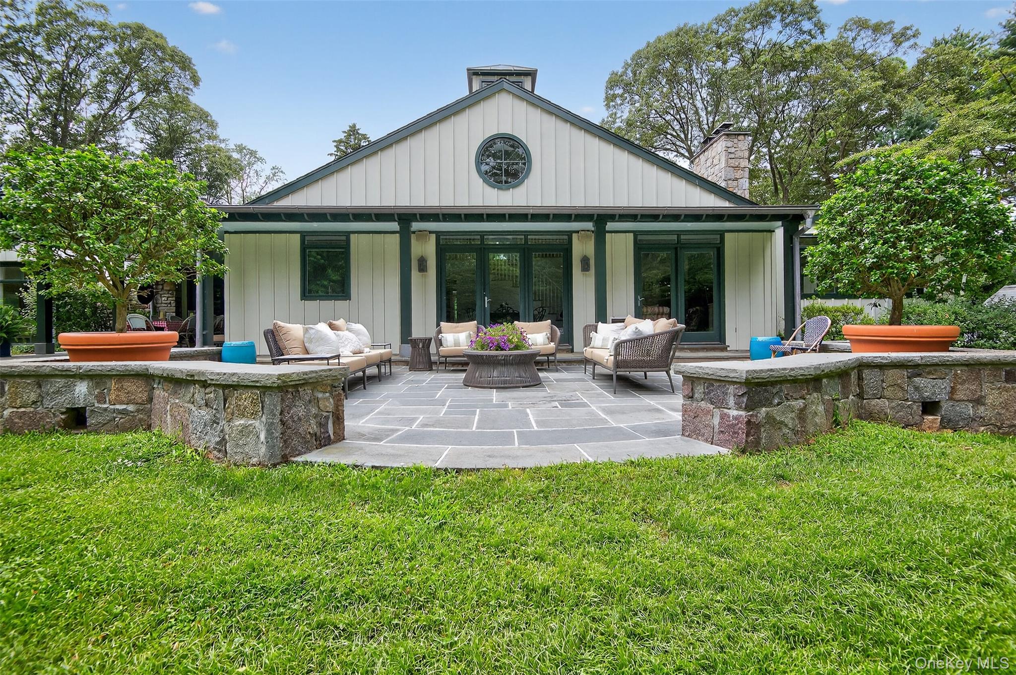 343 Chicken Valley Road Glen Head, NY 11545 - Photo 30 of 49 a view of a house with backyard sitting area and garden