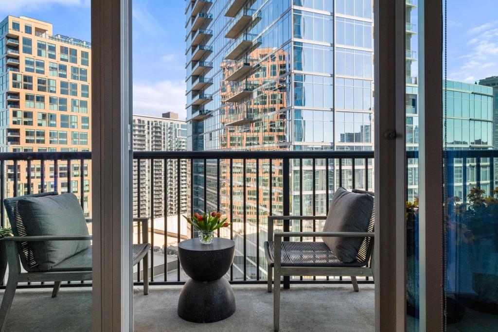 1080 Peachtree Street Northeast, Unit 1906 Atlanta, GA 30309 - Photo 13 of 46 a view of a balcony with chairs