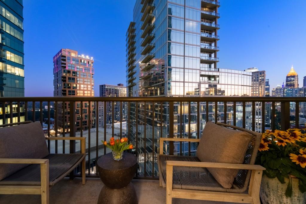 1080 Peachtree Street Northeast, Unit 1906 Atlanta, GA 30309 - Photo 14 of 46 a view of a balcony with chairs