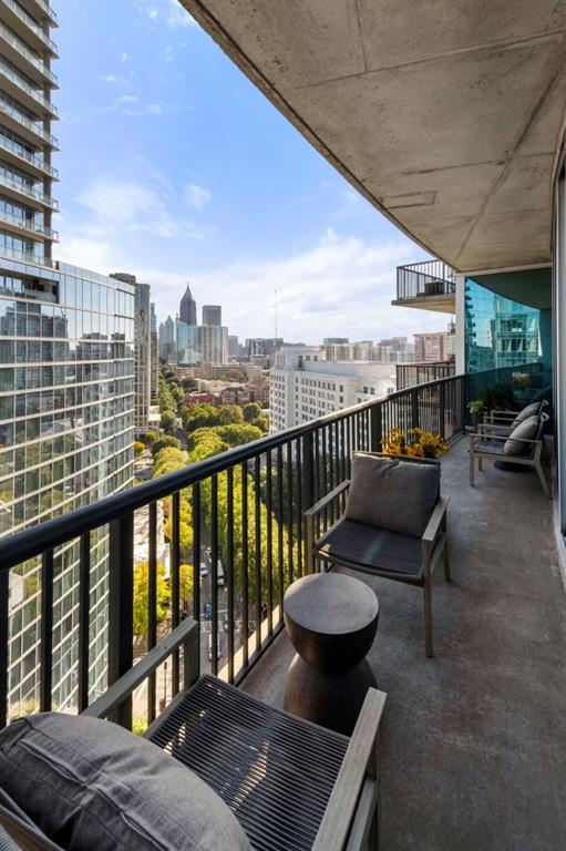 1080 Peachtree Street Northeast, Unit 1906 Atlanta, GA 30309 - Photo 18 of 46 a view of balcony with couch and chairs