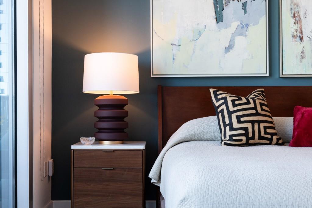 1080 Peachtree Street Northeast, Unit 1906 Atlanta, GA 30309 - Photo 21 of 46 a bedroom with a bed and a painting on the wall