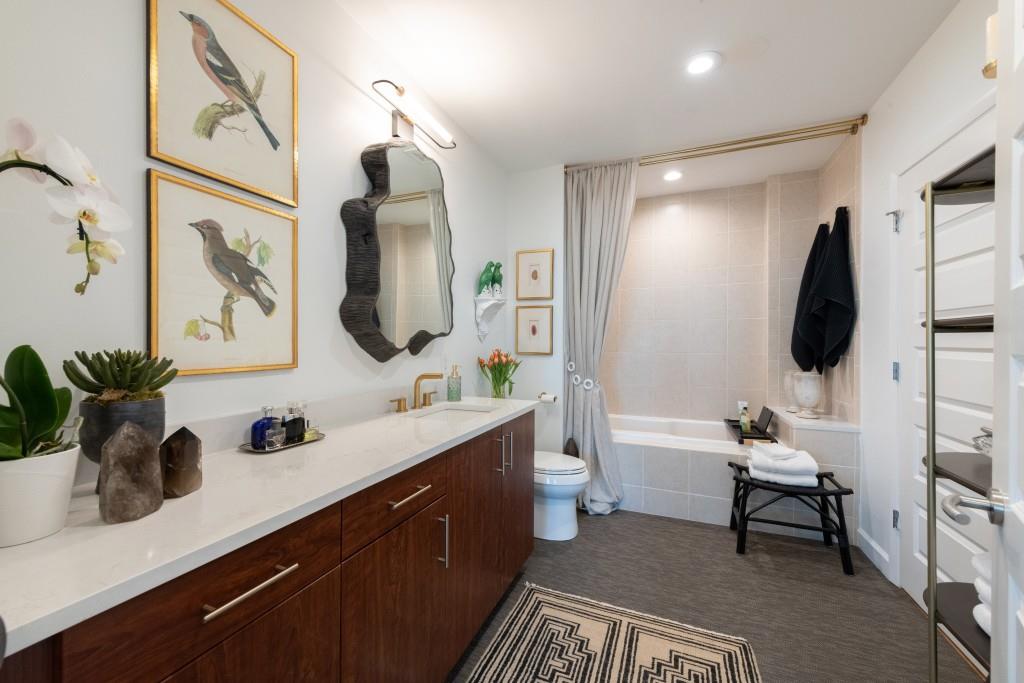 1080 Peachtree Street Northeast, Unit 1906 Atlanta, GA 30309 - Photo 26 of 46 a bathroom with a sink and a mirror