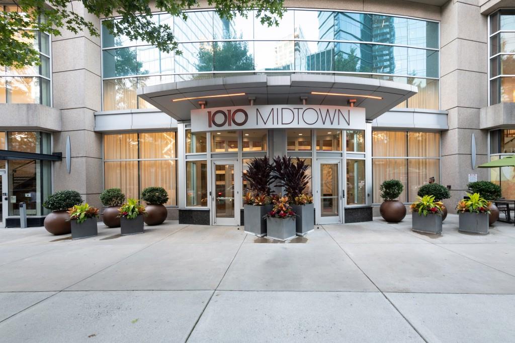 1080 Peachtree Street Northeast, Unit 1906 Atlanta, GA 30309 - Photo 31 of 46 a view of a store with a table and chairs under an umbrella
