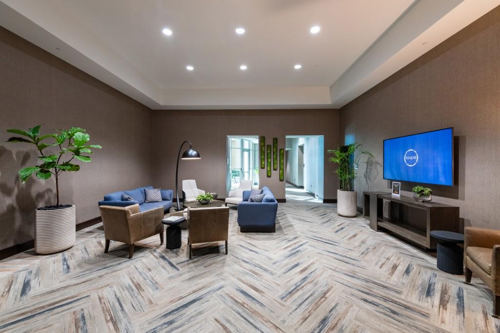 1080 Peachtree Street Northeast, Unit 1906 Atlanta, GA 30309 - Photo 33 of 46 a living room with furniture a large window and a fireplace