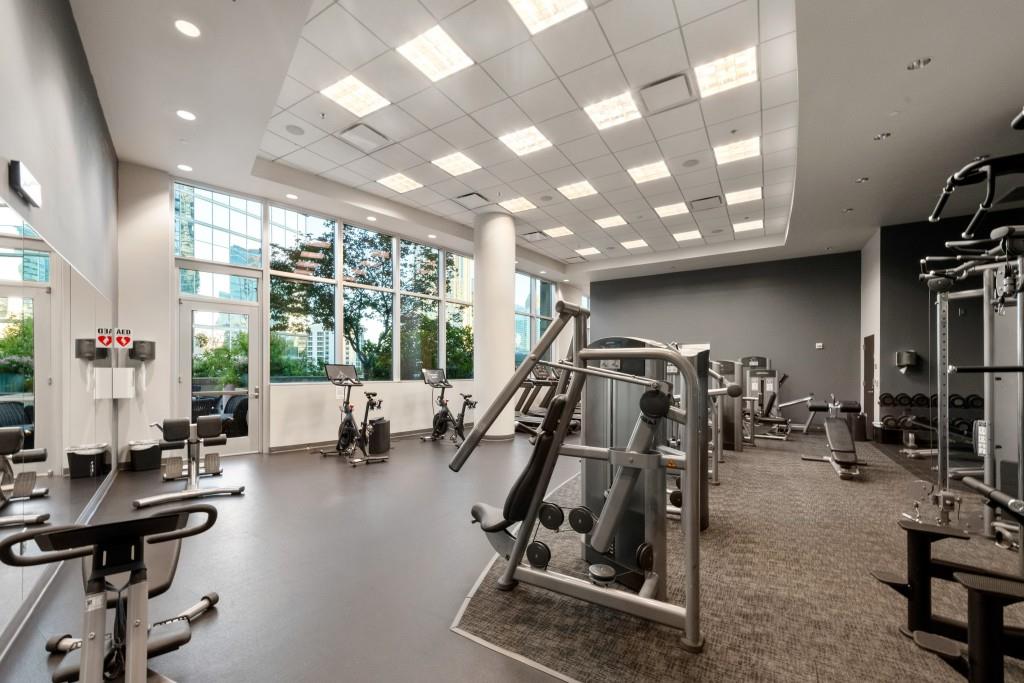 1080 Peachtree Street Northeast, Unit 1906 Atlanta, GA 30309 - Photo 34 of 46 a view of a room with gym equipment