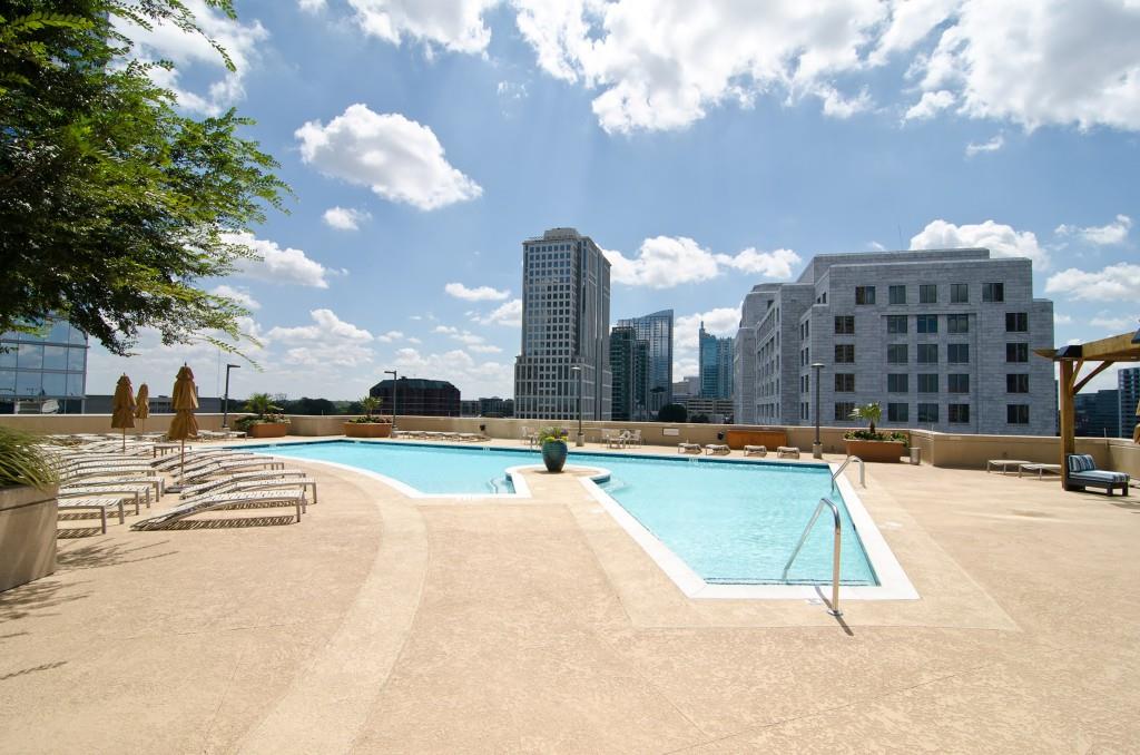 1080 Peachtree Street Northeast, Unit 1906 Atlanta, GA 30309 - Photo 41 of 46 a view of a swimming pool with outdoor seating