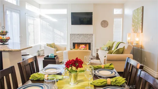 a living room with furniture fireplace and a flat screen tv