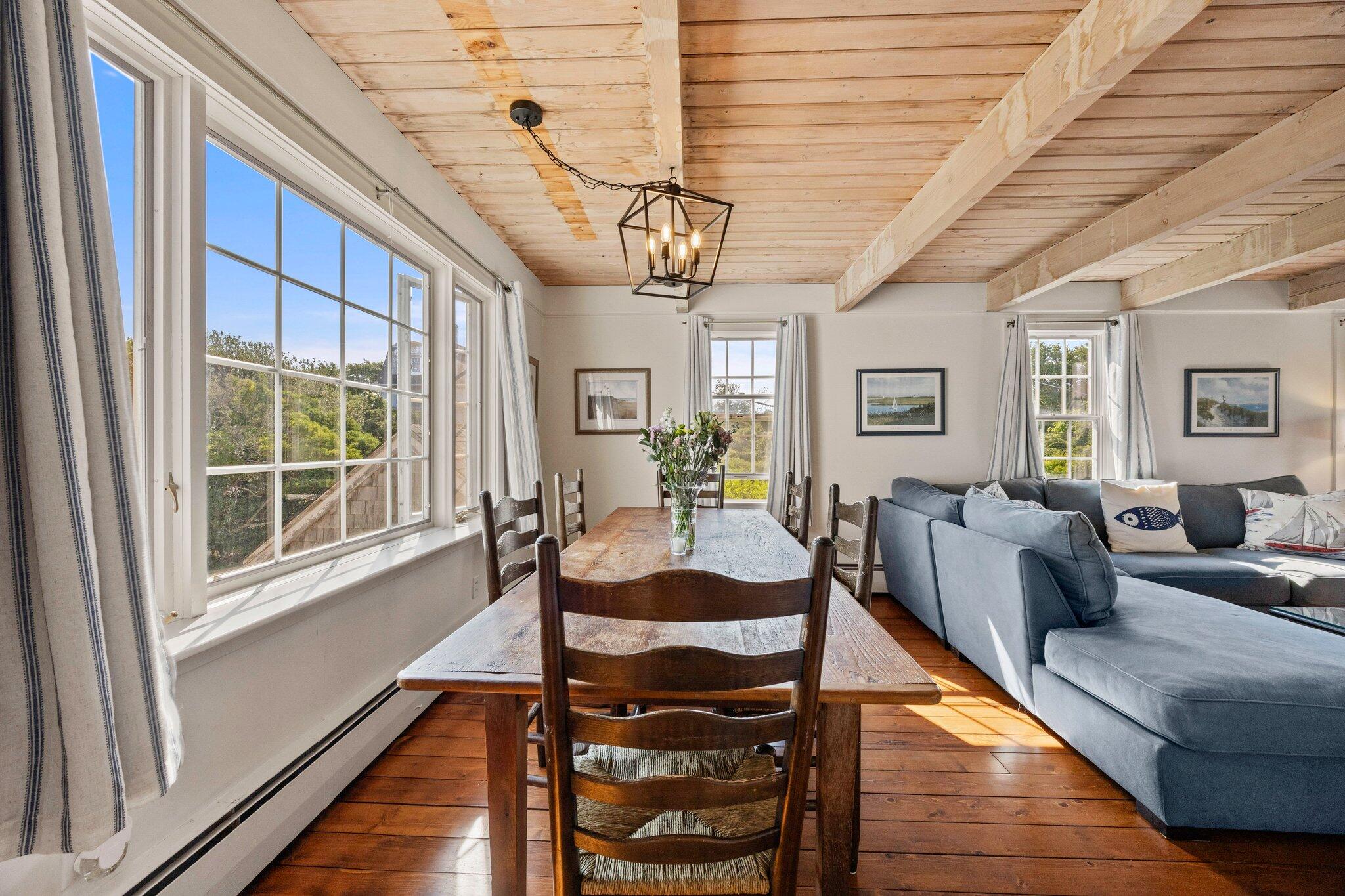47 Quasson Road Chatham, MA 02633 - Photo 11 of 47 a living room with furniture a wooden floor and next to a window