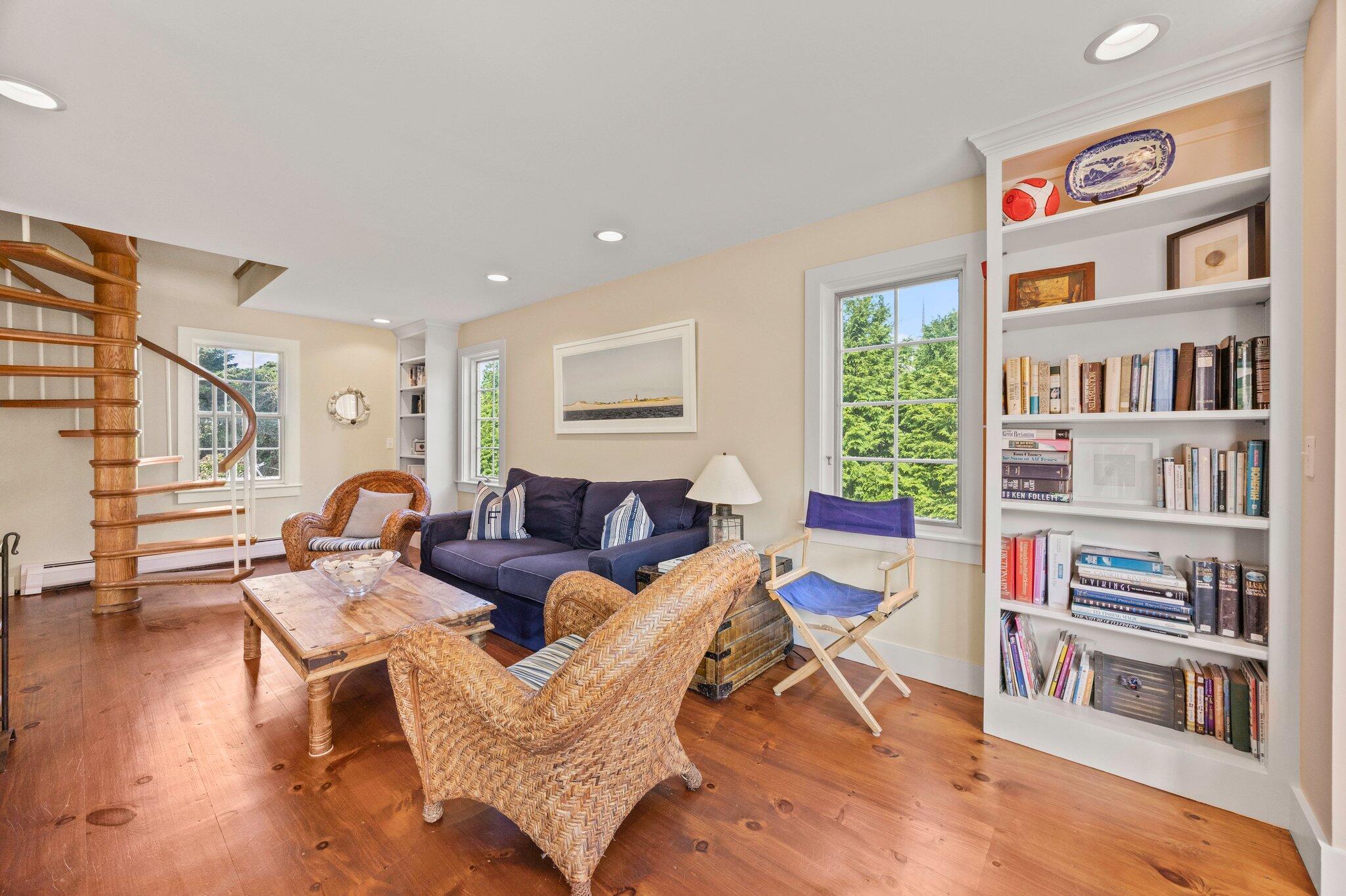 47 Quasson Road Chatham, MA 02633 - Photo 16 of 47 a living room with furniture and a book shelf