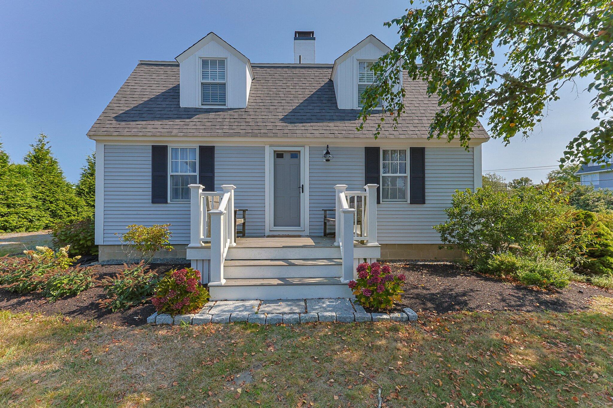 47 Quasson Road Chatham, MA 02633 - Photo 2 of 47 a front view of a house with a garden