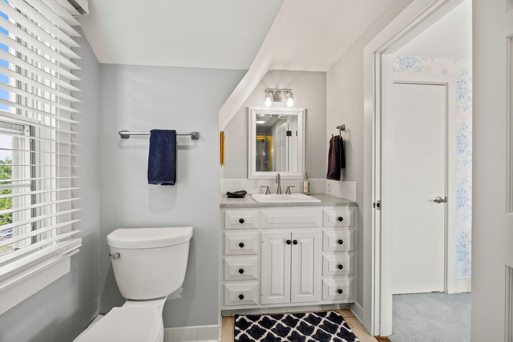 47 Quasson Road Chatham, MA 02633 - Photo 26 of 47 a bathroom with a sink a toilet a large mirror and shower