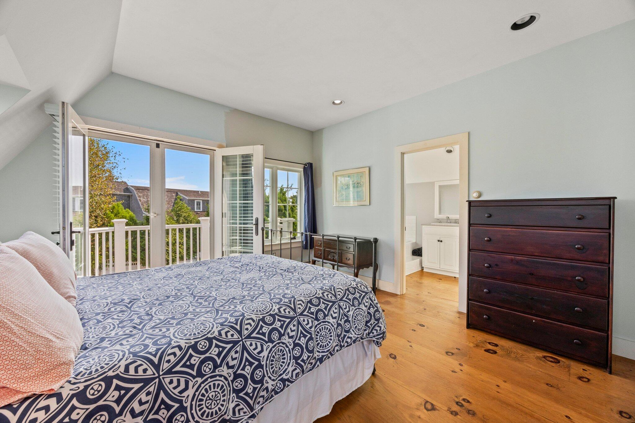47 Quasson Road Chatham, MA 02633 - Photo 27 of 47 a bedroom with a bed and a dresser