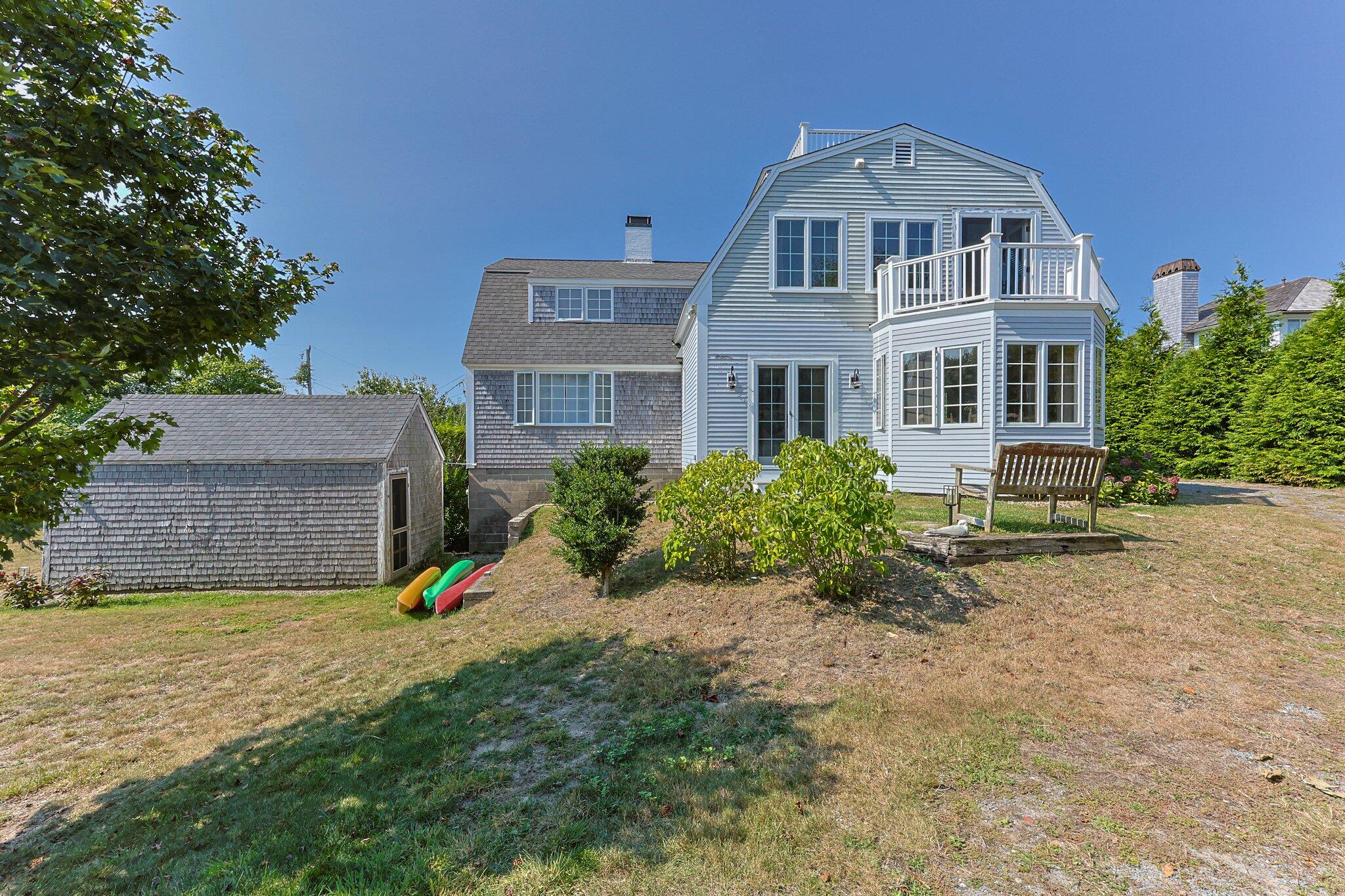 47 Quasson Road Chatham, MA 02633 - Photo 34 of 47 a front view of a house with a yard