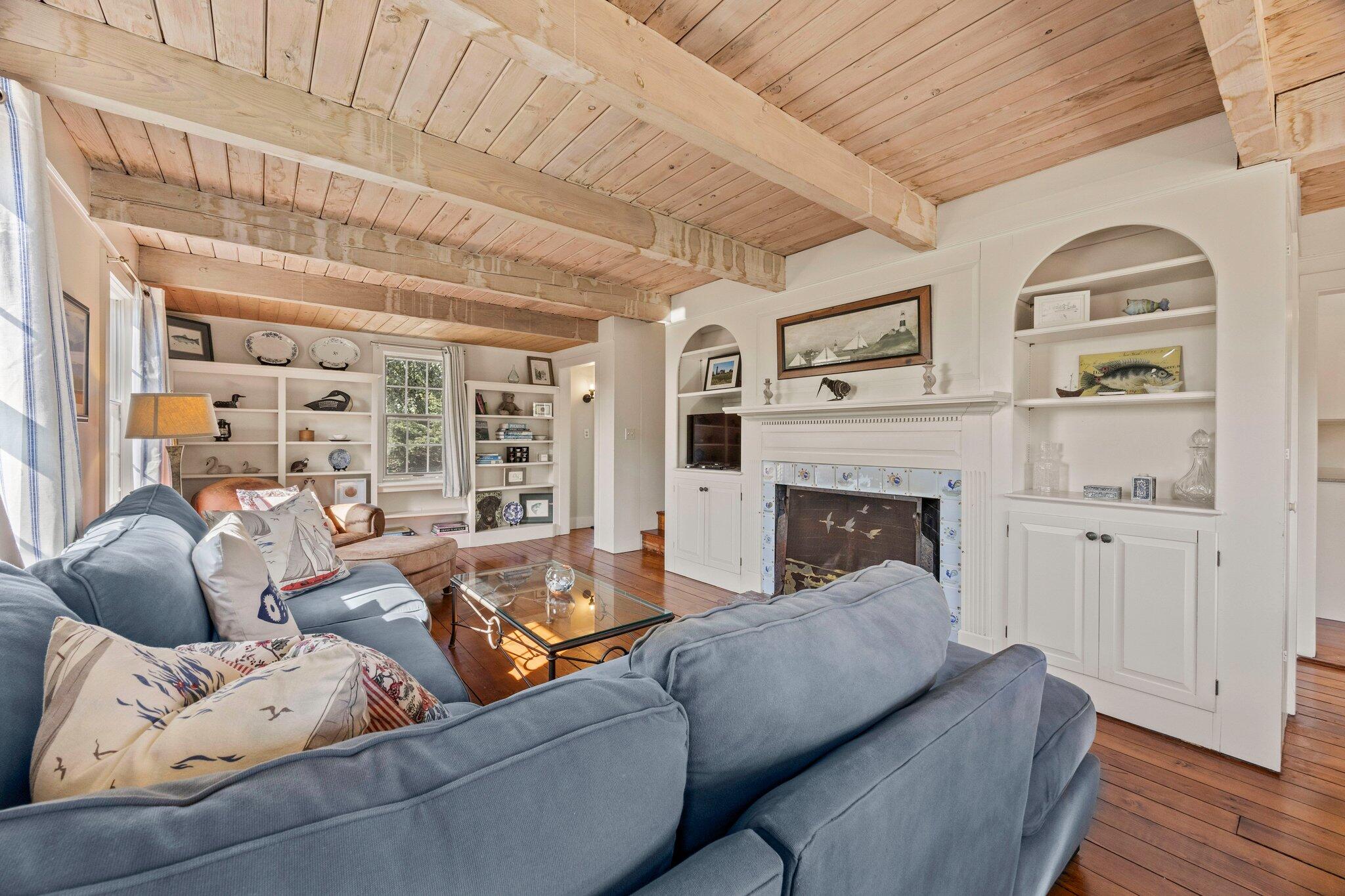 47 Quasson Road Chatham, MA 02633 - Photo 10 of 47 a living room with furniture and a fireplace