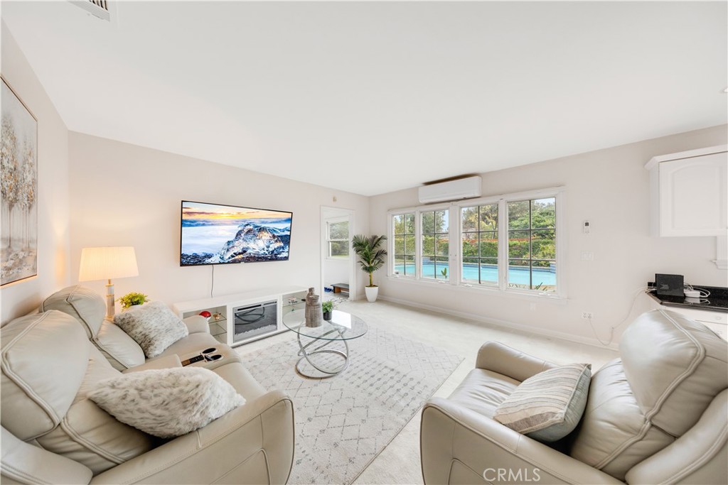 2835 Devonport Road San Marino, CA 91108 - Photo 23 of 54 a living room with furniture and a large window