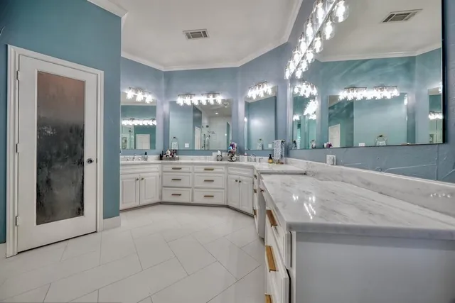 a view of a double vanity sink and a mirror