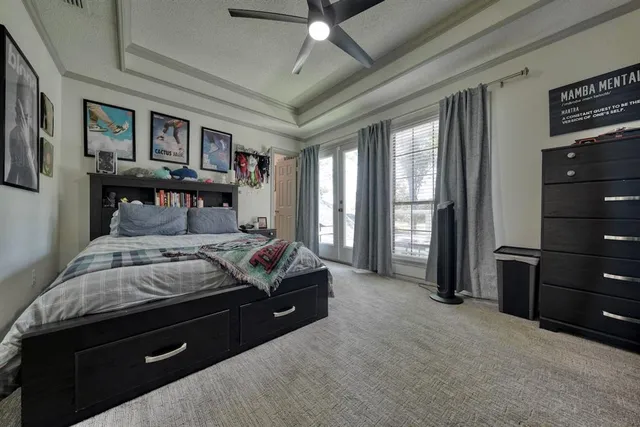 a bedroom with a bed and a cabinets