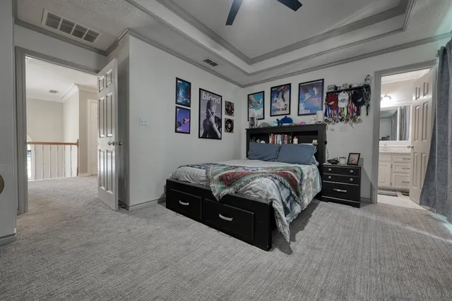 a bedroom with a bed and dresser