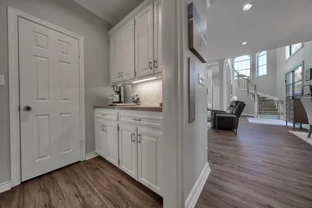 a view of a kitchen cabinets and wooden floor
