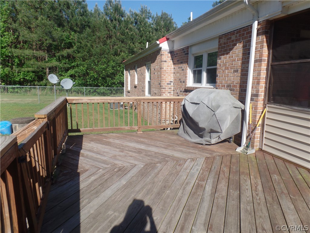 11108 Hitchcock Road Disputanta, VA 23842 - Photo 16 of 19 Large Rear Deck with Gate