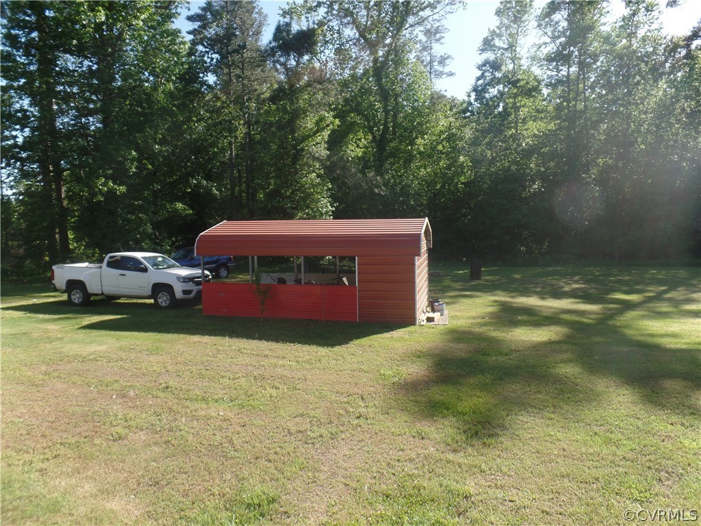 11108 Hitchcock Road Disputanta, VA 23842 - Photo 17 of 19 Carport with Storage