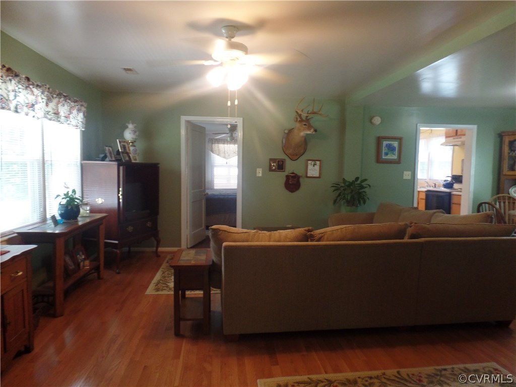 11108 Hitchcock Road Disputanta, VA 23842 - Photo 4 of 19 Large Family Room with Wood Floors and Ceiling Fan