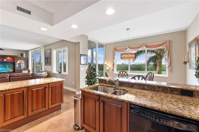 a kitchen with lots of counter top space and wooden floor