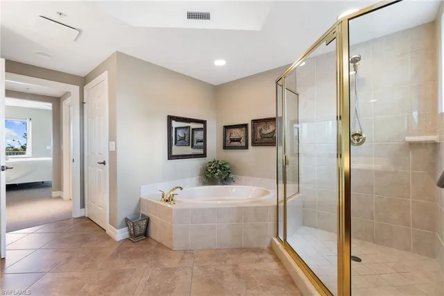 a bathroom with a tub and shower