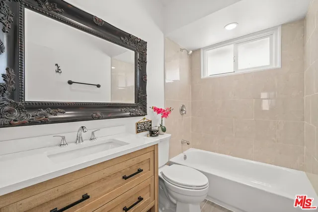 a bathroom with a sink a toilet and a bathtub