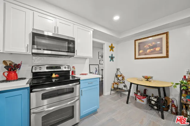 a kitchen with a stove and a microwave