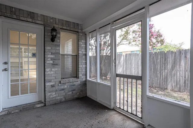 a view of an empty room with a balcony
