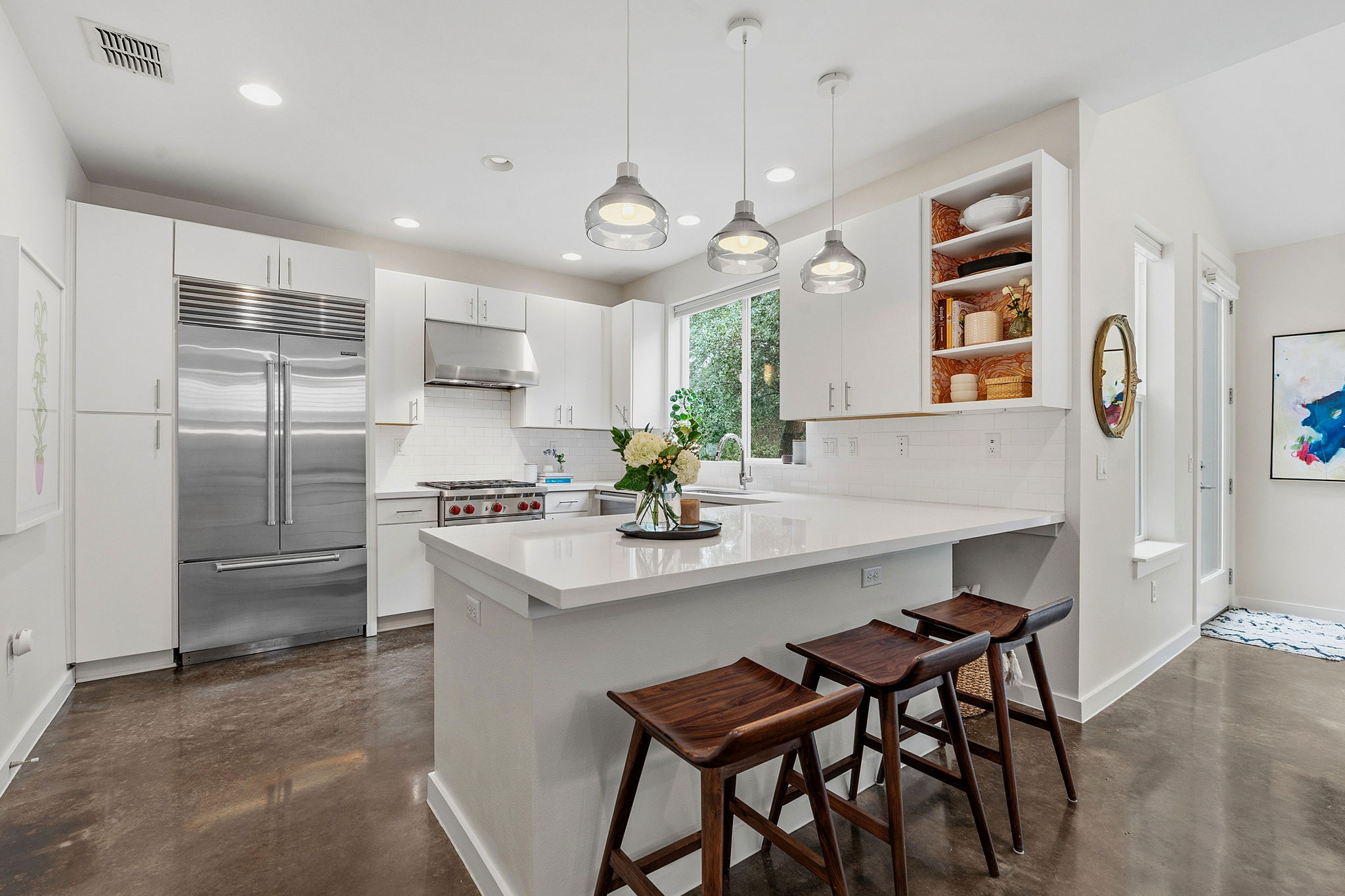 3001 Del Curto Road, Unit 31 Austin, TX 78704 - Photo 4 of 32 a kitchen with refrigerator a sink and chairs