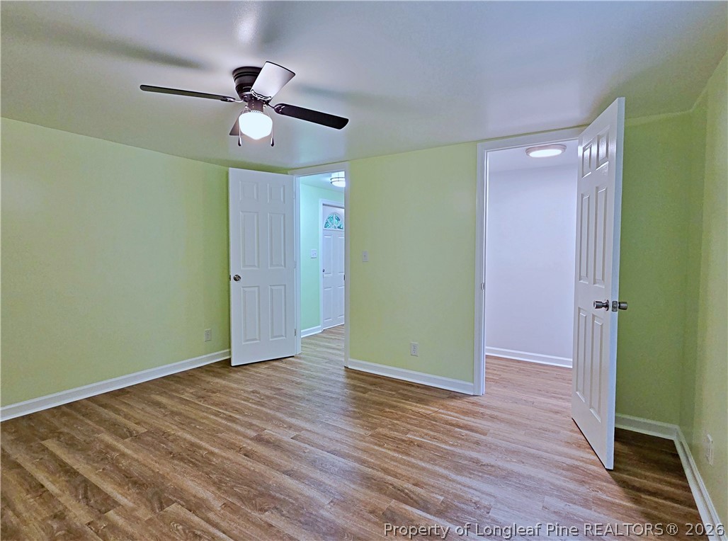 1031 Pine Acres Road White Oak, NC 28399 - Photo 13 of 29 a view of empty room with wooden floor