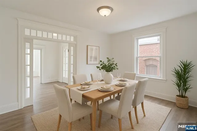 a view of a dining room with furniture and window
