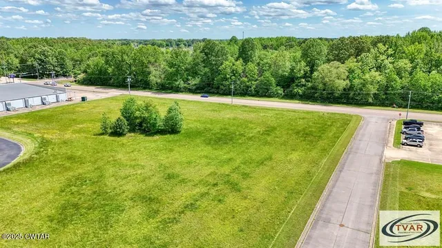a view of a garden and basketball court