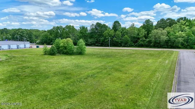 a view of yard with swimming pool