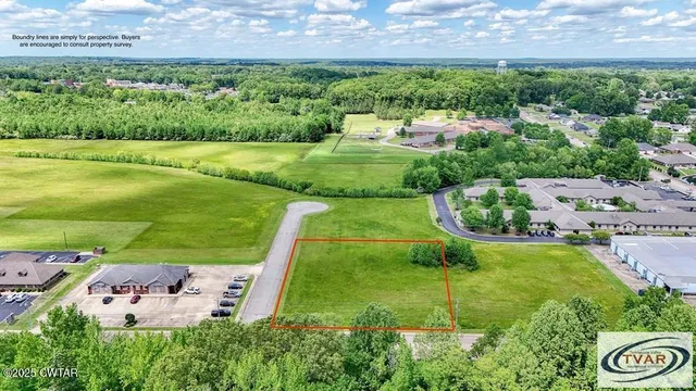 a view of a golf course with chairs