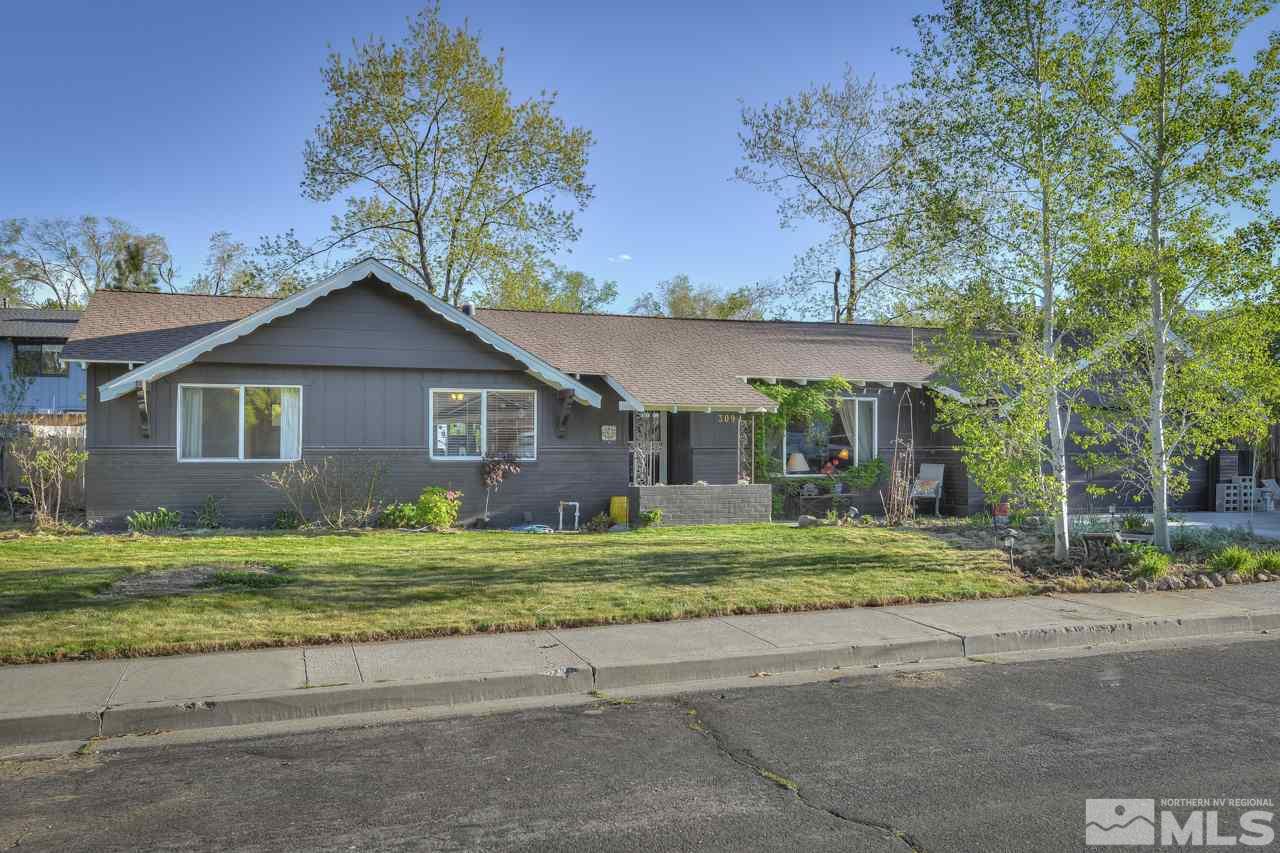 3090 Rowland Road Reno, NV 89509 - Photo 1 of 1 a front view of a house with a yard