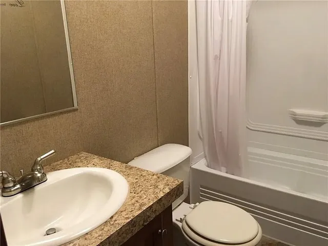 a view of empty room with windows