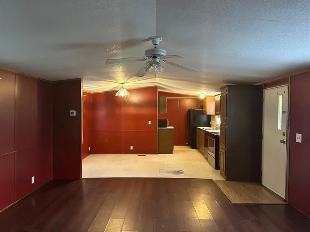 a kitchen with a sink cabinets and window